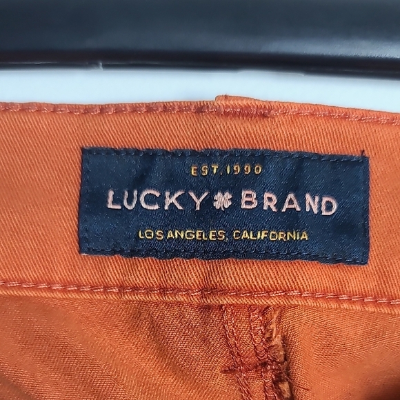 LUCKY BRAND Rust Orange Colored Pants With Blue Stripes Down Side Size 12/31 - Picture 2 of 16